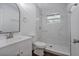 Stylish bathroom with marble shower and white vanity at 1213 Baranova Rd, Ocoee, FL 34761