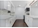 White kitchen features shaker cabinets, quartz countertops, and a center island at 1213 Baranova Rd, Ocoee, FL 34761