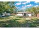 Large backyard with a newly renovated house at 1213 Baranova Rd, Ocoee, FL 34761
