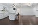Modern kitchen with white cabinets, quartz countertops, and stainless steel appliances at 1213 Baranova Rd, Ocoee, FL 34761
