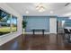 Living room with hardwood floors and an accent wall at 1213 Baranova Rd, Ocoee, FL 34761