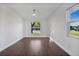 Spacious bedroom with dark brown flooring and large windows at 1213 Baranova Rd, Ocoee, FL 34761