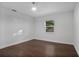Spacious bedroom with wood floors and window at 1213 Baranova Rd, Ocoee, FL 34761