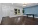 Bright living room with dark hardwood floors at 1213 Baranova Rd, Ocoee, FL 34761