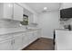 Renovated kitchen with white cabinets and quartz countertops at 1213 Baranova Rd, Ocoee, FL 34761