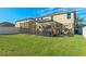 Two-story house with a large backyard and screened patio at 1911 Betsy Ross Ln, St Cloud, FL 34769