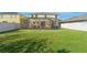Two-story house with a large backyard and screened patio at 1911 Betsy Ross Ln, St Cloud, FL 34769
