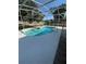 Refreshing kidney-shaped pool with a screened enclosure at 1833 Queen Palm Dr, Apopka, FL 32712