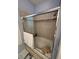 Bathroom with a tub and shower, and glass sliding doors at 1833 Queen Palm Dr, Apopka, FL 32712