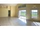 Bright living room with tile floors and access to patio at 2688 Hawthorne Ln, Kissimmee, FL 34743