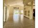 Spacious living room with tile floors and access to a patio at 2688 Hawthorne Ln, Kissimmee, FL 34743