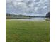 Peaceful lake view from the backyard at 2688 Hawthorne Ln, Kissimmee, FL 34743