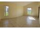 Spacious bedroom with tile floors and large windows at 2688 Hawthorne Ln, Kissimmee, FL 34743
