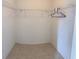 Spacious walk-in closet with wire shelving and hanging rods at 2688 Hawthorne Ln, Kissimmee, FL 34743
