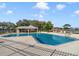Relax by the community pool with shaded seating at 2688 Hawthorne Ln, Kissimmee, FL 34743