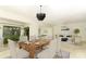 Open concept dining room with a wooden table and chandelier at 807 Westwind Ln, Fern Park, FL 32730