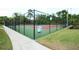 Well-maintained tennis court with chain link fence at 807 Westwind Ln, Fern Park, FL 32730