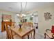 Spacious dining area with glass-top table and view to living room at 4249 E Weeping Willow Cir, Winter Springs, FL 32708