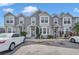 Front view of three-unit townhouses with gray siding at 4249 E Weeping Willow Cir, Winter Springs, FL 32708