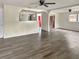 Living room features wood-look flooring and ceiling fan at 1904 Historic Goldsboro Blvd, Sanford, FL 32771