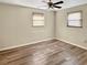 Spacious bedroom with wood-look flooring and ceiling fan at 1904 Historic Goldsboro Blvd, Sanford, FL 32771