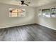 Bright living room with large windows and wood-look flooring at 1904 Historic Goldsboro Blvd, Sanford, FL 32771