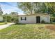 Newly painted house exterior with carport and small yard at 626 Caliente Way, Altamonte Springs, FL 32714