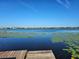 Calm lake view with wooden dock at 4715 Beach Blvd, Orlando, FL 32803