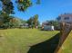 Vacant lot with grass and partial view of neighboring property at 4715 Beach Blvd, Orlando, FL 32803