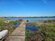 Wooden dock provides lake access at 4715 Beach Blvd, Orlando, FL 32803