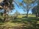 Peaceful lakeside view with lush greenery at 4715 Beach Blvd, Orlando, FL 32803