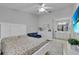 Bright and airy main bedroom with a plush bed and sitting area at 1017 Love Ln # 34, Apopka, FL 32703