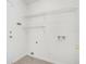 Laundry room with wire shelving for storage at 1957 Teaberry Ct, Orlando, FL 32824