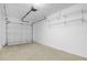 Garage with overhead door and storage shelving at 1957 Teaberry Ct, Orlando, FL 32824