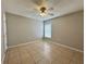 Spacious bedroom with tile flooring and ceiling fan at 817 Highland Crest Loop, Lake Wales, FL 33853