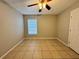 Bright bedroom with tile floor and ceiling fan at 817 Highland Crest Loop, Lake Wales, FL 33853