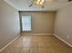 Bright bedroom with tile flooring and a window with blinds at 817 Highland Crest Loop, Lake Wales, FL 33853