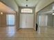 Bright and spacious entryway with double doors and tile flooring at 817 Highland Crest Loop, Lake Wales, FL 33853