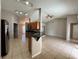 Open kitchen with breakfast bar, stainless steel appliances, and wood cabinets at 817 Highland Crest Loop, Lake Wales, FL 33853