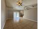 Bright living room with sliding glass doors leading to the backyard at 817 Highland Crest Loop, Lake Wales, FL 33853
