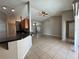 Bright and spacious living room with tile flooring and a ceiling fan at 817 Highland Crest Loop, Lake Wales, FL 33853