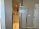 Shower stall with glass enclosure and tiled walls at 817 Highland Crest Loop, Lake Wales, FL 33853