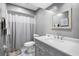 Modern bathroom with gray vanity, white countertop, and shower at 551 Finchley Rd # 551, Maitland, FL 32751