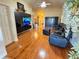 Spacious living room with hardwood floors and a large sectional sofa at 400 Bridge Creek Blvd, Ocoee, FL 34761