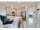 Modern kitchen with stainless steel appliances and island at 543 Ocean Course Ave, Davenport, FL 33896