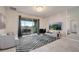 Modern living room features a large TV, comfortable seating, and a view of a balcony and golf course at 543 Ocean Course Ave, Davenport, FL 33896