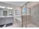 Modern bathroom with double vanity, large shower, and a soaking tub at 543 Ocean Course Ave, Davenport, FL 33896