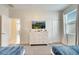 Bedroom with twin beds and dresser at 543 Ocean Course Ave, Davenport, FL 33896