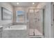 Elegant bathroom with soaking tub and walk-in shower at 543 Ocean Course Ave, Davenport, FL 33896