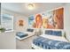 bedroom with twin beds and Lion King mural at 543 Ocean Course Ave, Davenport, FL 33896